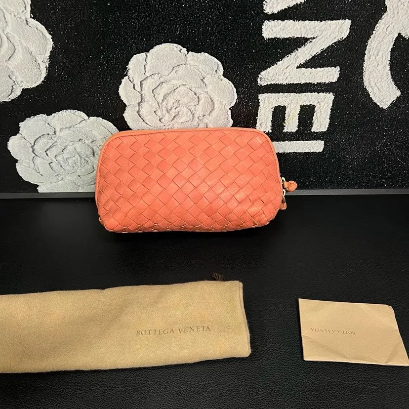bottega veneta coral pink woven toiletry clutch