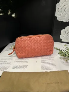bottega veneta coral pink woven toiletry clutch